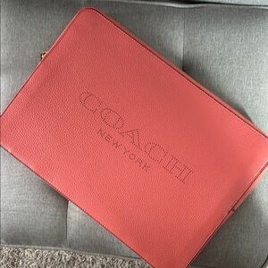 Coach pink leather laptop case.